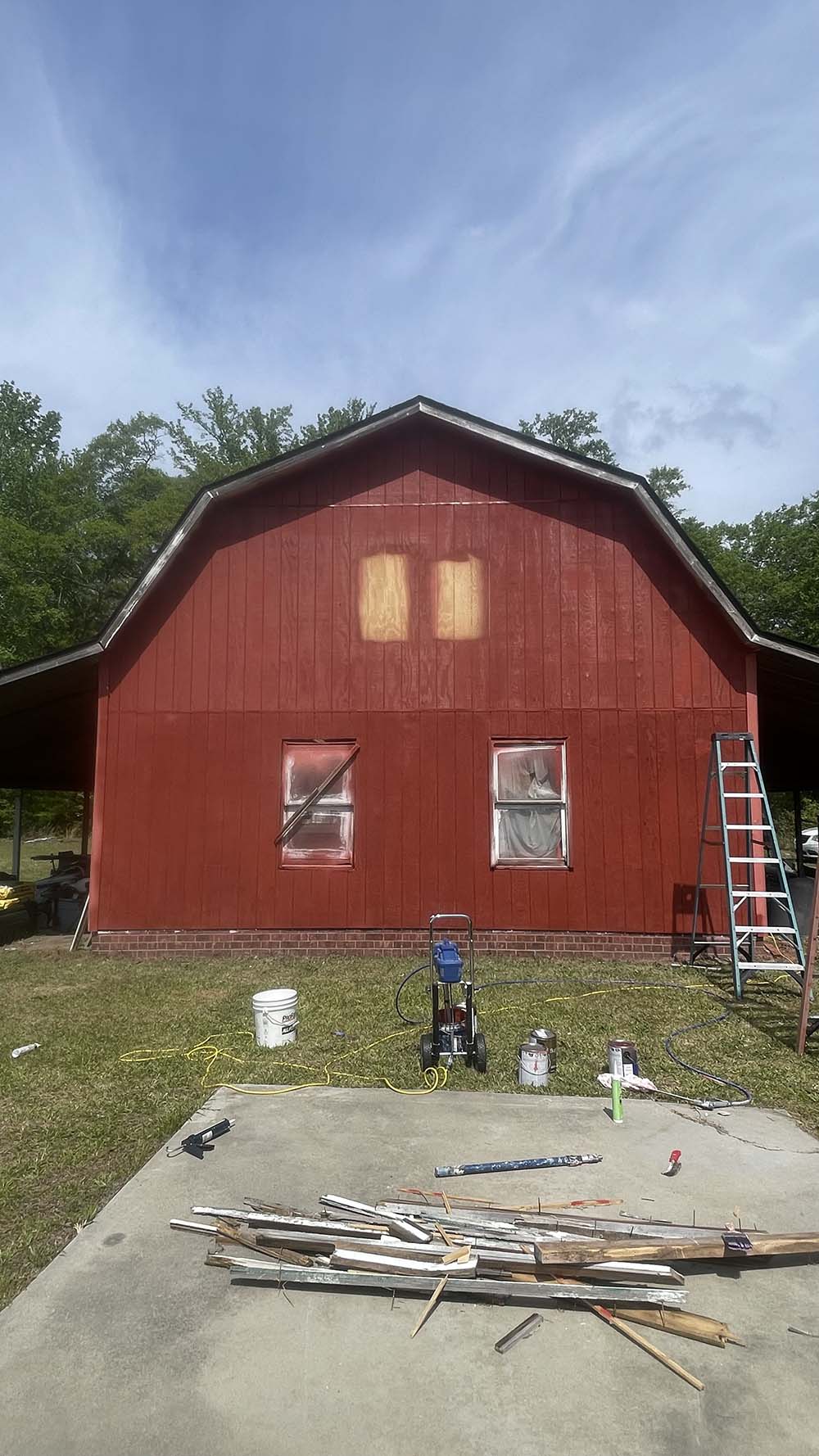 Airless spray rig and masked windows during Flower Pot paint application